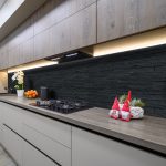 Trendy grey modern kitchen interior showcase with minimalistic furniture and some Christmas decoration at worktop