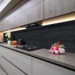 Trendy grey modern kitchen interior showcase with minimalistic furniture and some Christmas decoration at worktop