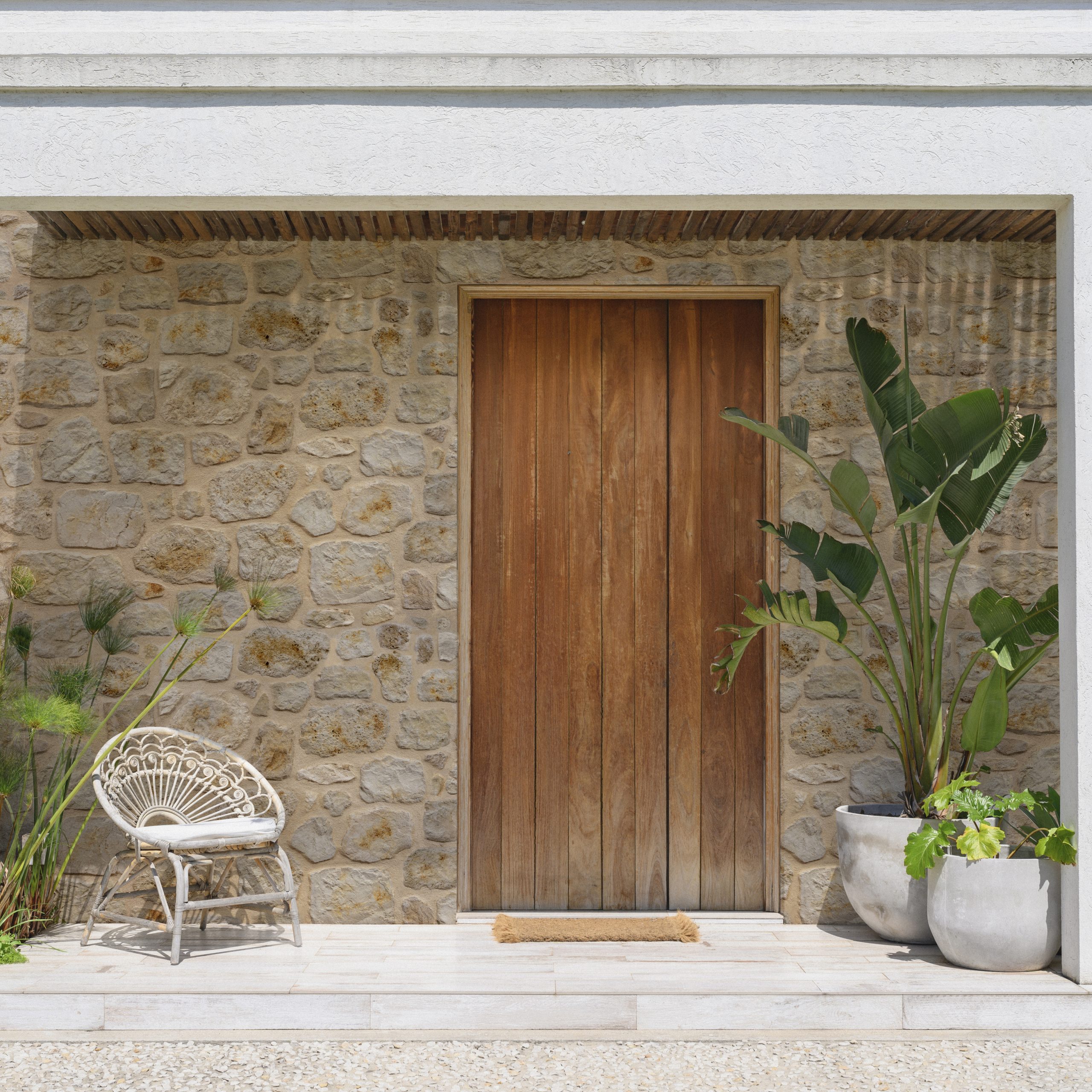 Close-up of entrance to modern Buenos Aires home with chair and potted plants on porch either side of front door.